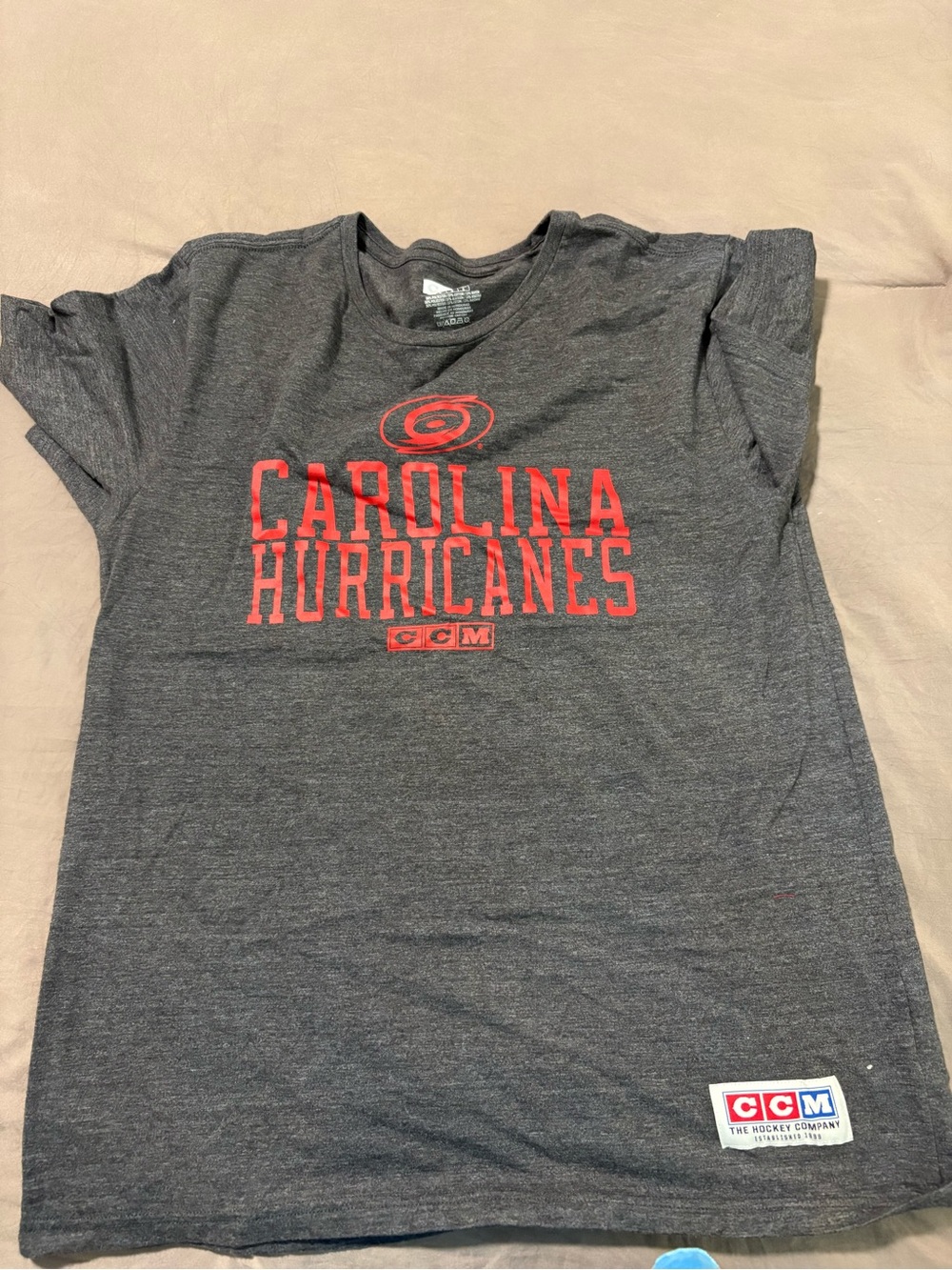 CCM Dark Gray Carolina Hurricanes Logo Tee with Red Print